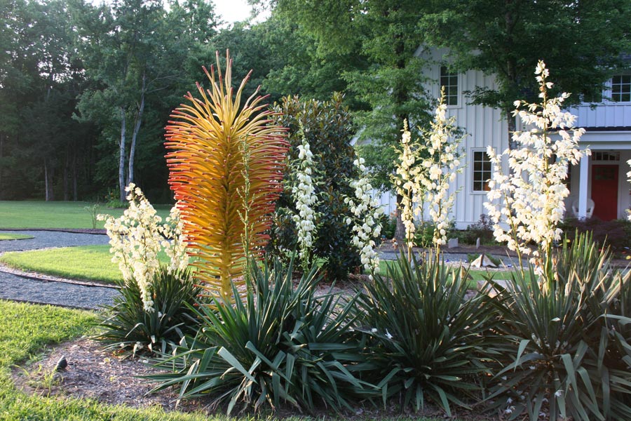 Abstract metal sculpture in a garden.